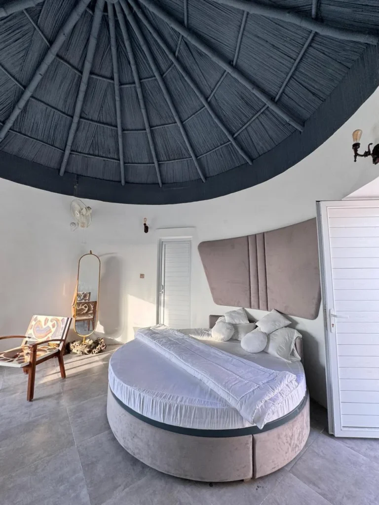 Interior of luxury room featuring modern and comfortable king size bed, furniture etc